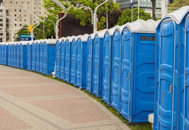 hygienic portable restrooms lined up at a music festival, providing comfort and convenience for attendees in Alhambra CA